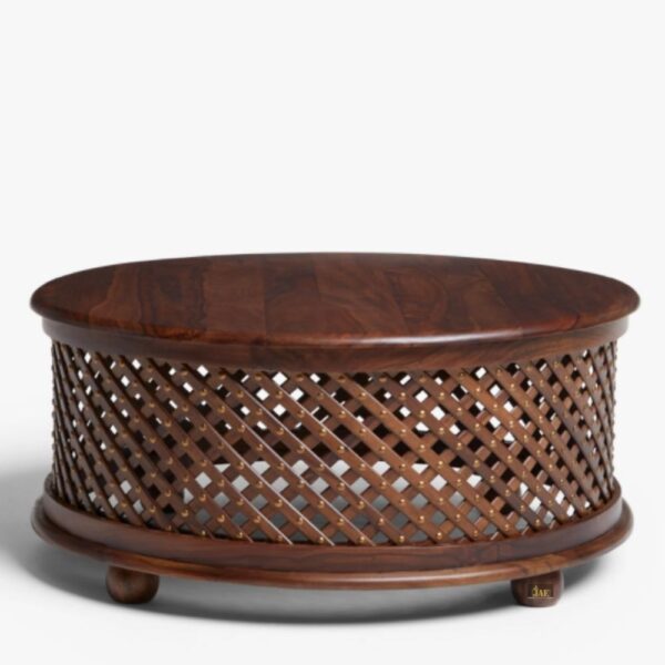 Welcome the Sheesh Wooden Round Jali Teapoy Coffee Table into your space and let the magic of sunlit whispers and rustic charm begin. wood coffee table for living room | carved furniture | teak furniture | solid wood furniture | JAE Furniture
