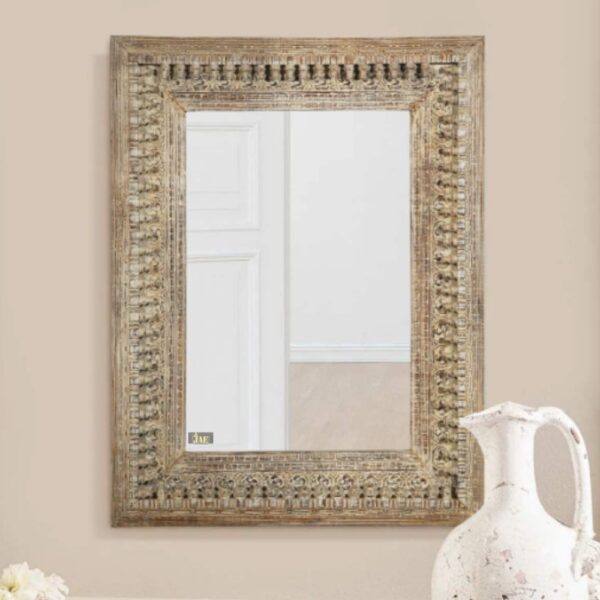 Uuvo Wooden Carved Wall Mirror Frame (Brown Distress) bathed in soft light, showcasing its Brown Distress finish and intricate wood carvings.