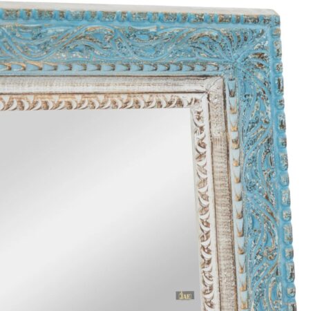 Handcrafted from Mango wood, the Sapeo mirror whispers stories of sun-kissed beaches and coastal charm. Detailed Image of Carvings on Wooden Frame