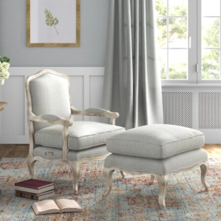 Sukre Wooden Designer Arm Chair with Foot Stool (Light Grey) with plush Light Grey upholstery and White Distress finish.